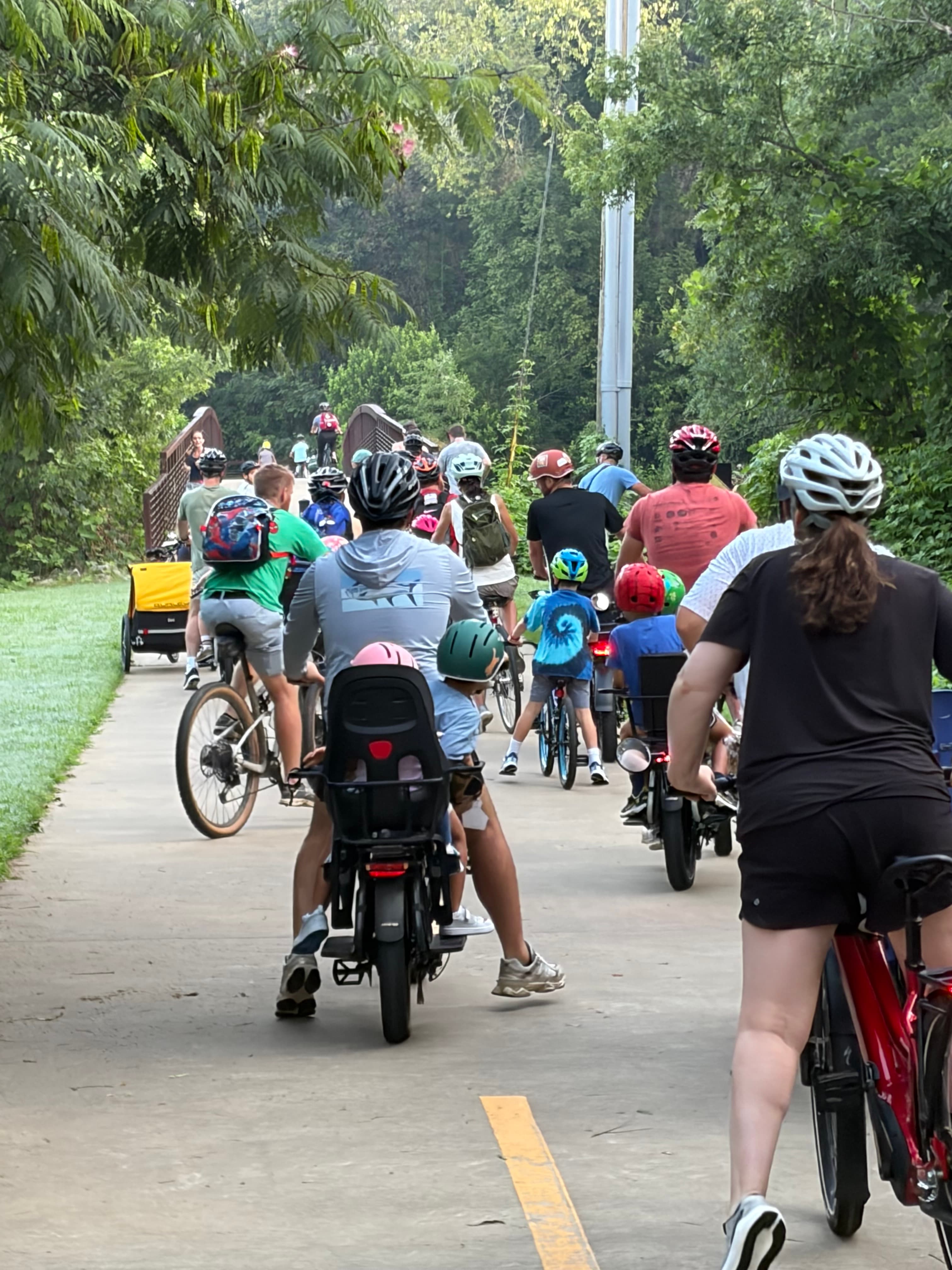 Rivers Riders kids and parents riding to school together